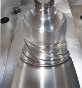 Precision-machined metal half mold for Ublo bottle packaging