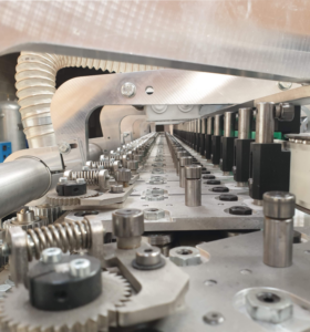Close-up view of the Ublo shuttle system inside the forming oven for packaging